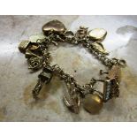 9 Carat Gold Charm Bracelet of Good Weight Decorated with Various Charms