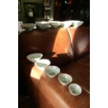 Unusual Set of Ten Graduated Oriental Famille Rose Green Ground Bowls of Very Thin Translucent