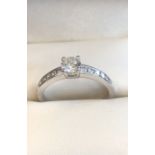 Solitaire Round Brilliant Cut Diamond Ring Set on Four Claw Setting with Further Diamond Decorated