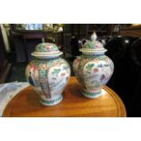 Pair of Oriental Porcelain Vases of Baluster Form with Finial Decorated Covers Please Note: Finial