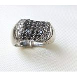 18 Carat White Gold Mounted Pave Set Diamond Ring Decorated with Black and White Diamonds