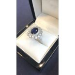 Sapphire and Diamond Cluster Ring Mounted on 14 Carat White Gold Centre Stone Oval Cut