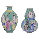 TWO CHINESE FAMILLE ROSE PORCELAIN SNUFF BOTTLES, 20TH CENTURY double gourd ovoid, each moulded in