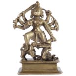 A BRASS FIGURE OF DURGA MAHISASURAMARDINI, WESTERN DECCAN, 16TH/17TH CENTURY the eight-armed goddess