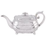 ˜A GEORGE III SILVER TEAPOT, SAMUEL WHEATLEY & JOHN EVANS, LONDON, 1811 oblong, the part-lobed