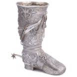 A GERMAN SILVER NOVELTY 'BOOT' VASE, PROBABLY HANAU, CIRCA 1885 cast, the elaborate design including