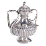 A MUGHAL SILVER SCENT BOTTLE, NORTHERN INDIA, CIRCA 1800 with ribbed bulbous body, standing on