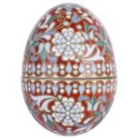 A RUSSIAN STYLE CLOISONNE ENAMEL AND SILVER-GILT EGG, 20TH CENTURY in two parts, foliate motifs