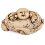 ˜STAINED IVORY NETSUKE OF HOTEI IN HIS SACK, CIRCA 1870 with a cat to one side, signed: Kyoju nin