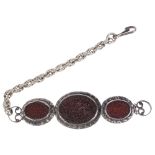 ‡ A SILVER AND CARNELIAN ARMLET, INDIA OR PERSIA, 19TH CENTURY composed of three oval medallions,