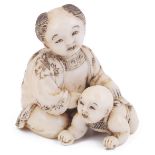 ˜IVORY NETSUKE OF TWO CHILDREN, CIRCA 1870 a karako with his infant brother, extensive incised