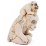 ˜LARGE IVORY NETSUKE OF A MONKEY AND YOUNG, CIRCA 1800 the adult a performing monkey in a jacket,