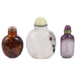 A STUDY COLLECTION OF THREE CHINESE HARDSTONE SNUFF BOTTLES comprising: a large black and white