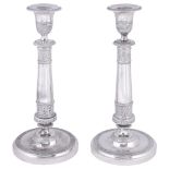 A PAIR OF ITALIAN SILVER CANDLESTICKS, EMANUELE CABER, MILAN, CIRCA 1830 the circular bases, stems