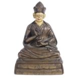 A BRONZE FIGURE OF A KARMAPA LAMA, TIBET, CIRCA 1800