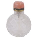 A CHINESE ROCK CRYSTAL SNUFF BOTTLE carved to each side with a stylised lotus, with agate stopper