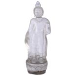 A ROCK CRYSTAL FIGURE OF BUDDHA, NEPAL, 20TH CENTURY standing on a lotus, his right hand in varada