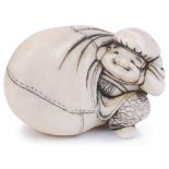 ˜IVORY NETSUKE OF THE LUCKY GOD DAIKOKU EMERGING FROM HIS SACK, CIRCA 1870 unsigned 3.8cm long