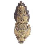 A FRAGMENT FROM A GILT-BRONZE FIGURE OF AVALOKITESVARA, TIBET, CIRCA 17TH CENTURY comprising the