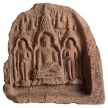 A CLAY VOTIVE PLAQUE, PAGAN, BURMA, CIRCA 12TH CENTURY of arched form, the impressed relief