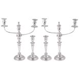 A SUITE OF FOUR GEORGE III SILVER CANDLESTICKS AND A PAIR OF CANDELABRA BRANCHES, WILLIAM TUCKER &