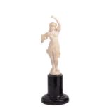 ˜AN IVORY FIGURE OF AN EXOTIC ANCIENT DANCER, PROBABLY GERMAN, CIRCA 1900 the young woman carved