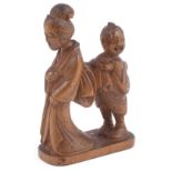 BOXWOOD NETSUKE OF AN OLD GEISHA FOLLOWED BY A SNIGGERING BOY, CIRCA 1870 signed: Seishu 4.8cm