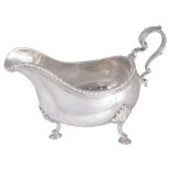 A GEORGE III SILVER SAUCEBOAT, PROBABLY JACOB MARSH, LONDON, 1766 oval, gadroon rim, shell-headed