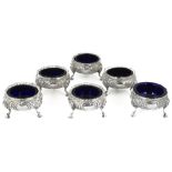 A SET OF SIX VICTORIAN SILVER SALT CELLARS, C.S. HARRIS, LONDON, 1888 in George II style, each on