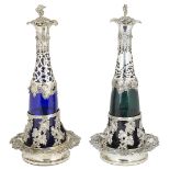 A PAIR OF GERMAN SILVER-MOUNTED GLASS DECANTERS ON SILVER COASTERS, HALLER & RATHENAU, BERLIN,