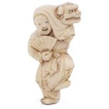 ˜IVORY NETSUKE OF A NEW YEAR SHISHIMAI DANCER, CIRCA 1870 his robe engraved with floral patterns,