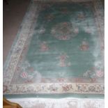 A Chinese rug, floral pattern on blue ground