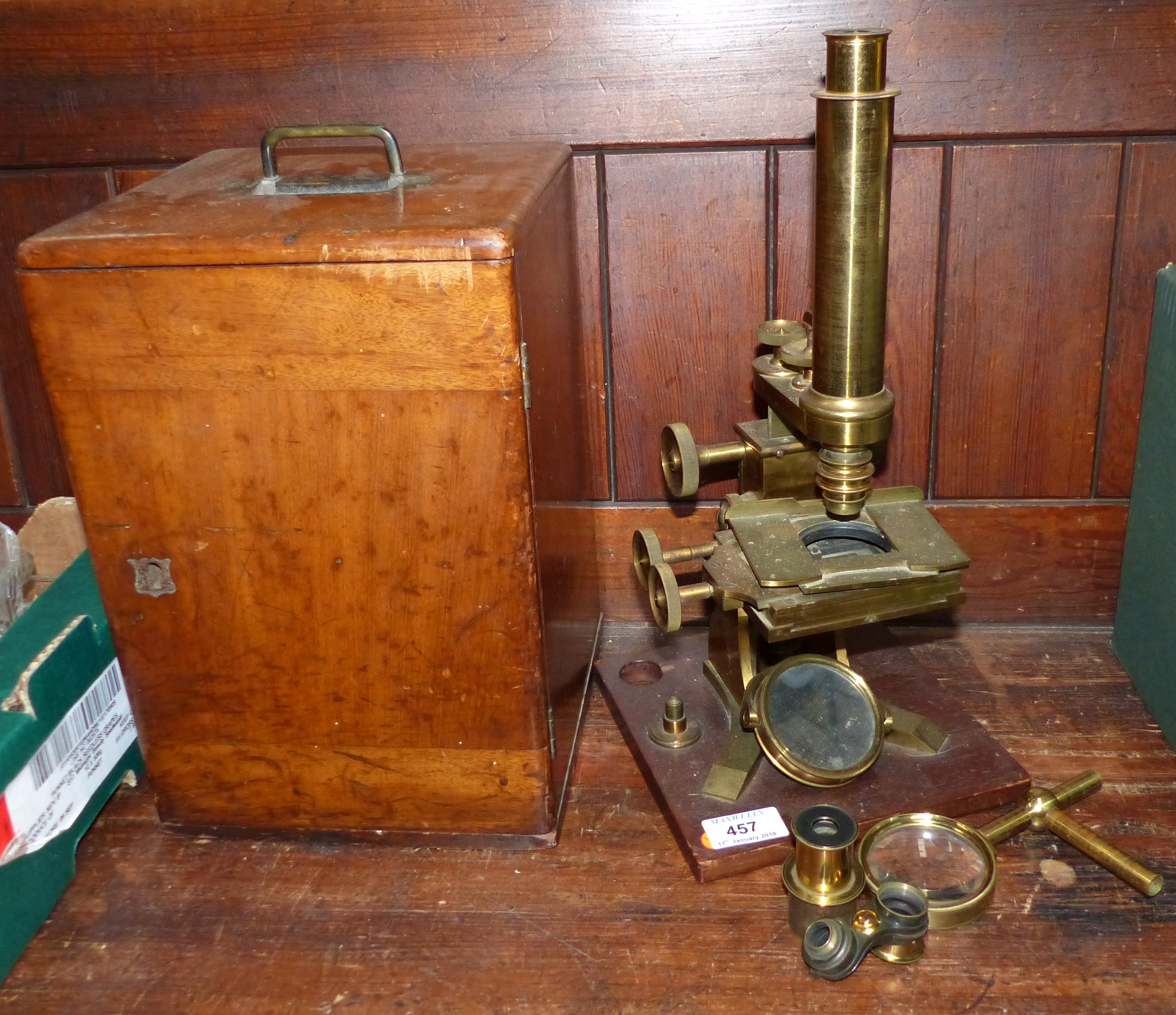 A 19th century brass microscope by By Baker, with accessories, mahogany case