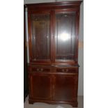 A Georgian style mahogany full height bookcase with 2 glazed doors over double cupboard and 2