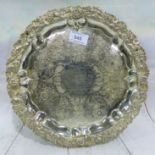 A silver salver with raised fruit and vine border, engraved dedication to James Kendrick Esq. M.