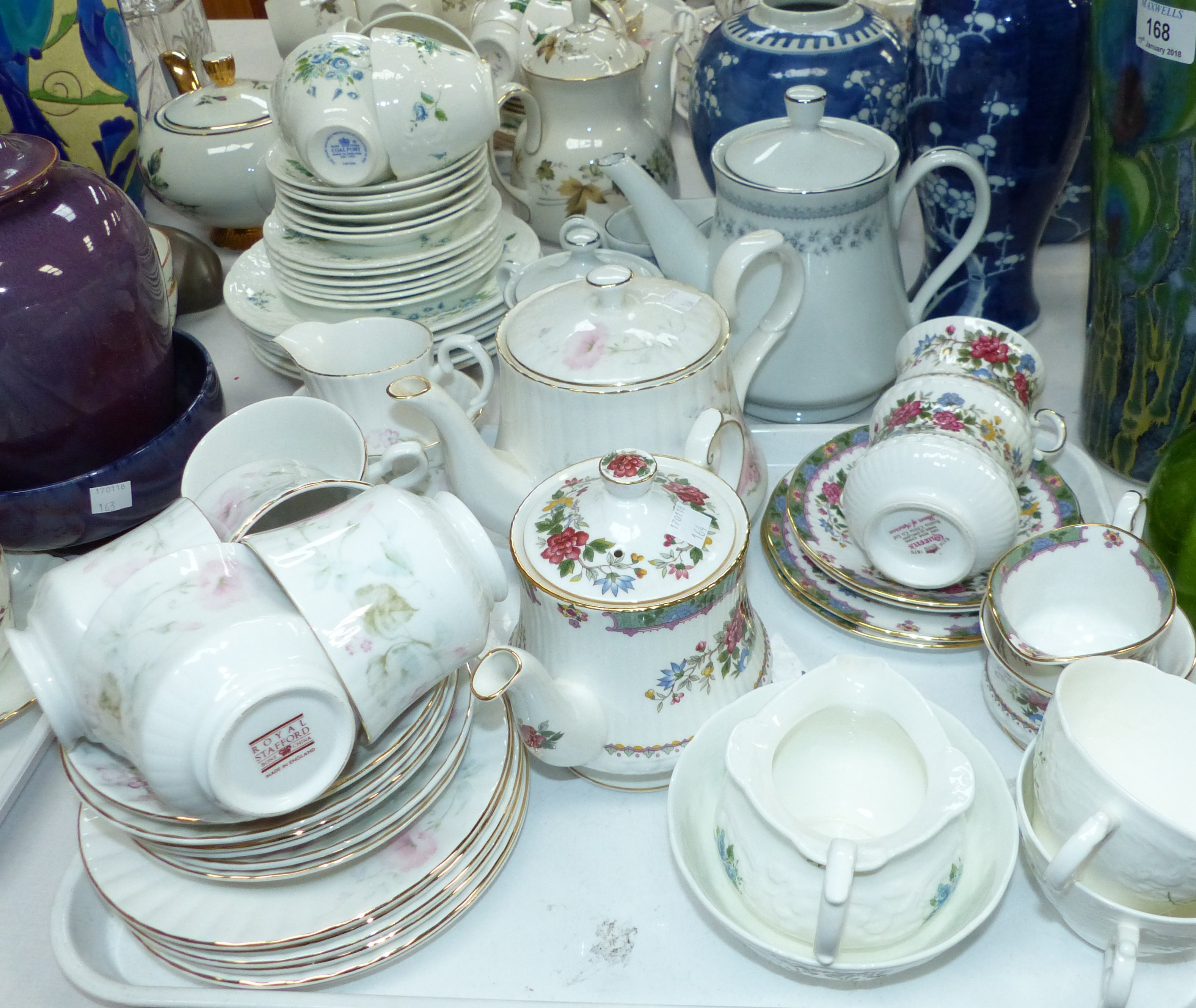 A Coalport Tintern pattern bone china tea set; a Hadleigh part set; a Royal Stafford set; a Queen'