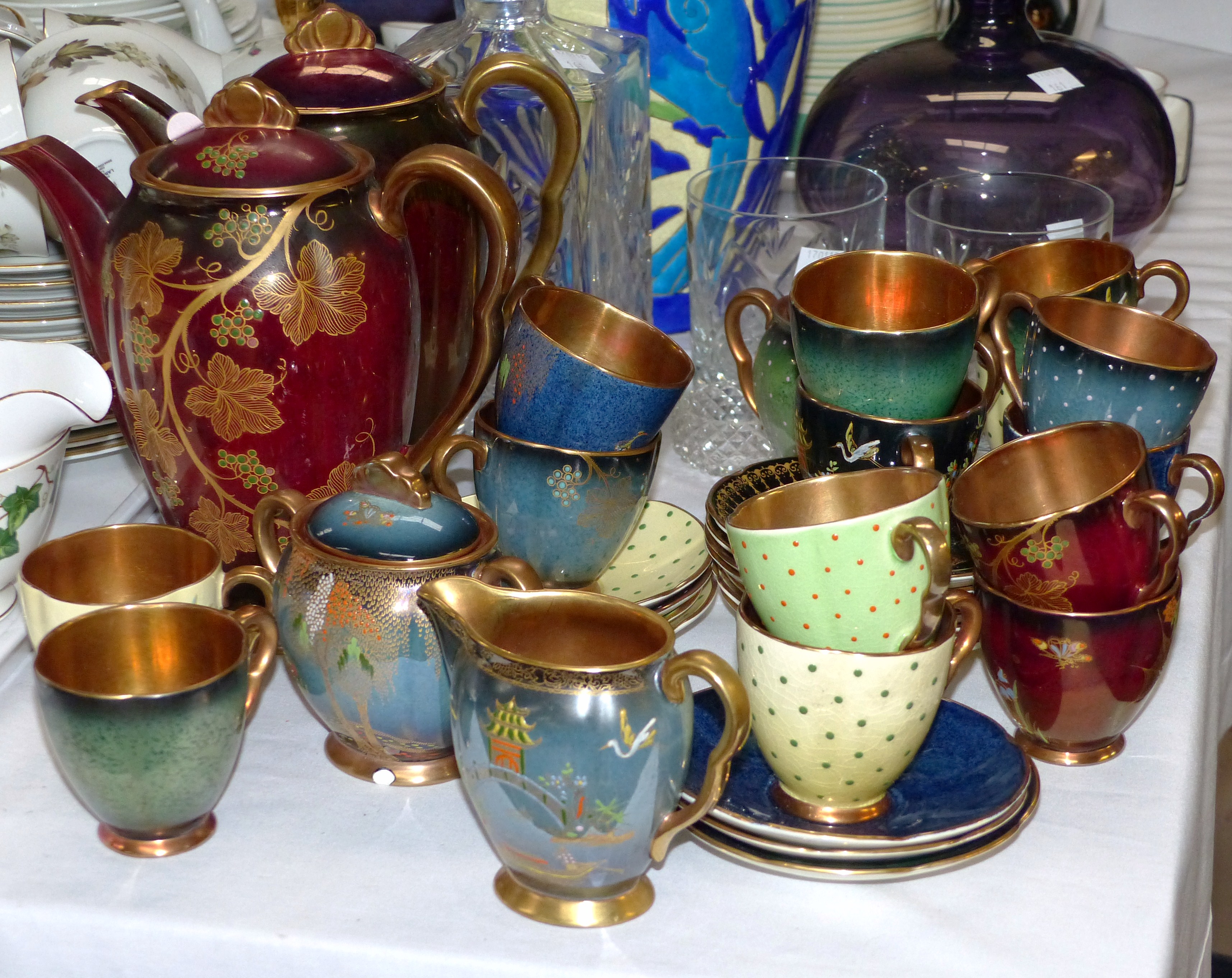 Two Carlton Ware coffee pots and a selection of various Carlton ware coffee cups saucers etc