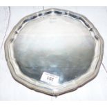 A Georgian style silver salver, pie crust edging, on 3 ball and claw feet, 18½ oz.