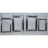 A pair of silver picture frames, 7" x 5" overall; 2 others