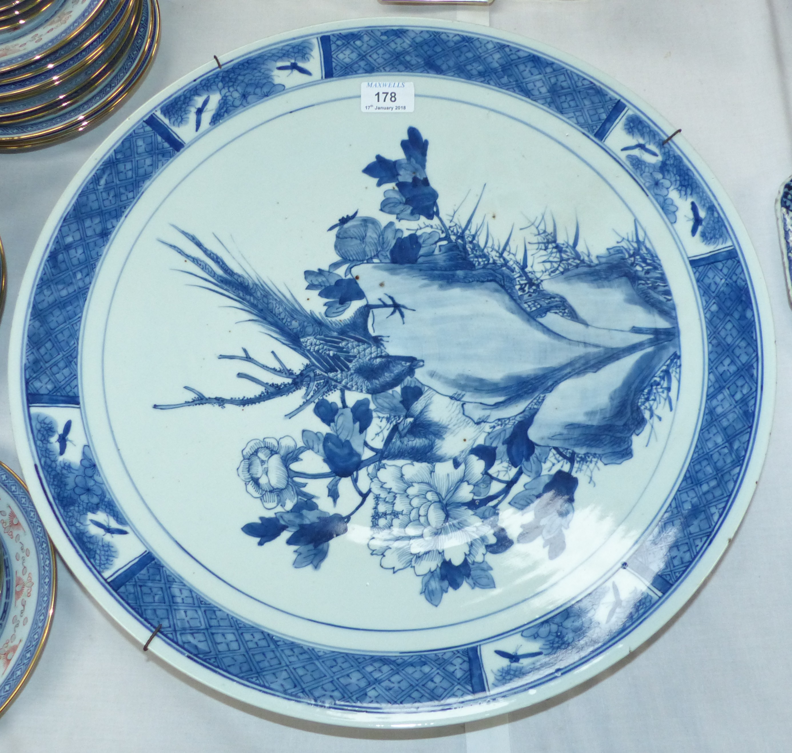 A large oriental blue and white porcelain circular charger, 18¾"