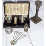 A silver 3 piece cruet set, cased; a candlestick; a set of silver coffee spoons; a pepper and a