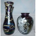 An iridescent baluster vase, mottled purple with white swirled decoration, indistinct etched