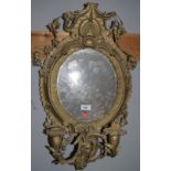 An oval twin sconce girandole mirror, gilt framed, height 24"