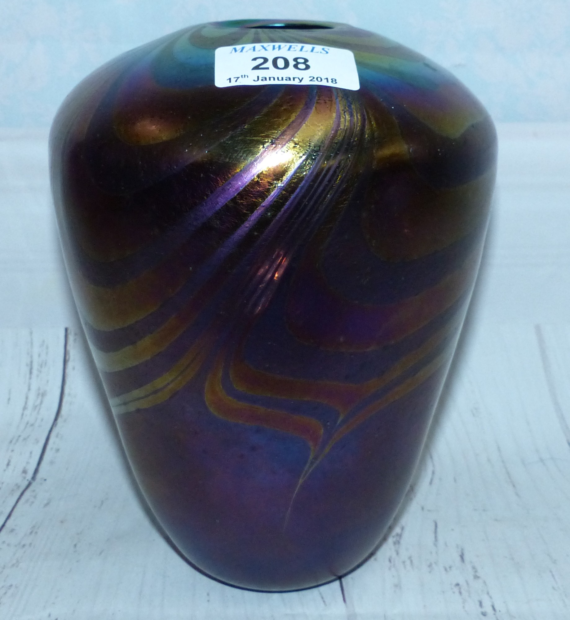 A John Ditchfield Art Glass iridescent vase of tapering form with swirled decoration, "Glassform" No