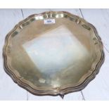 A hallmarked silver Georgian style salver with scalloped border and 3 scroll feet, 23 oz.