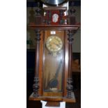 A 19th century Vienna style walnut wall clock with spring driven striking movement