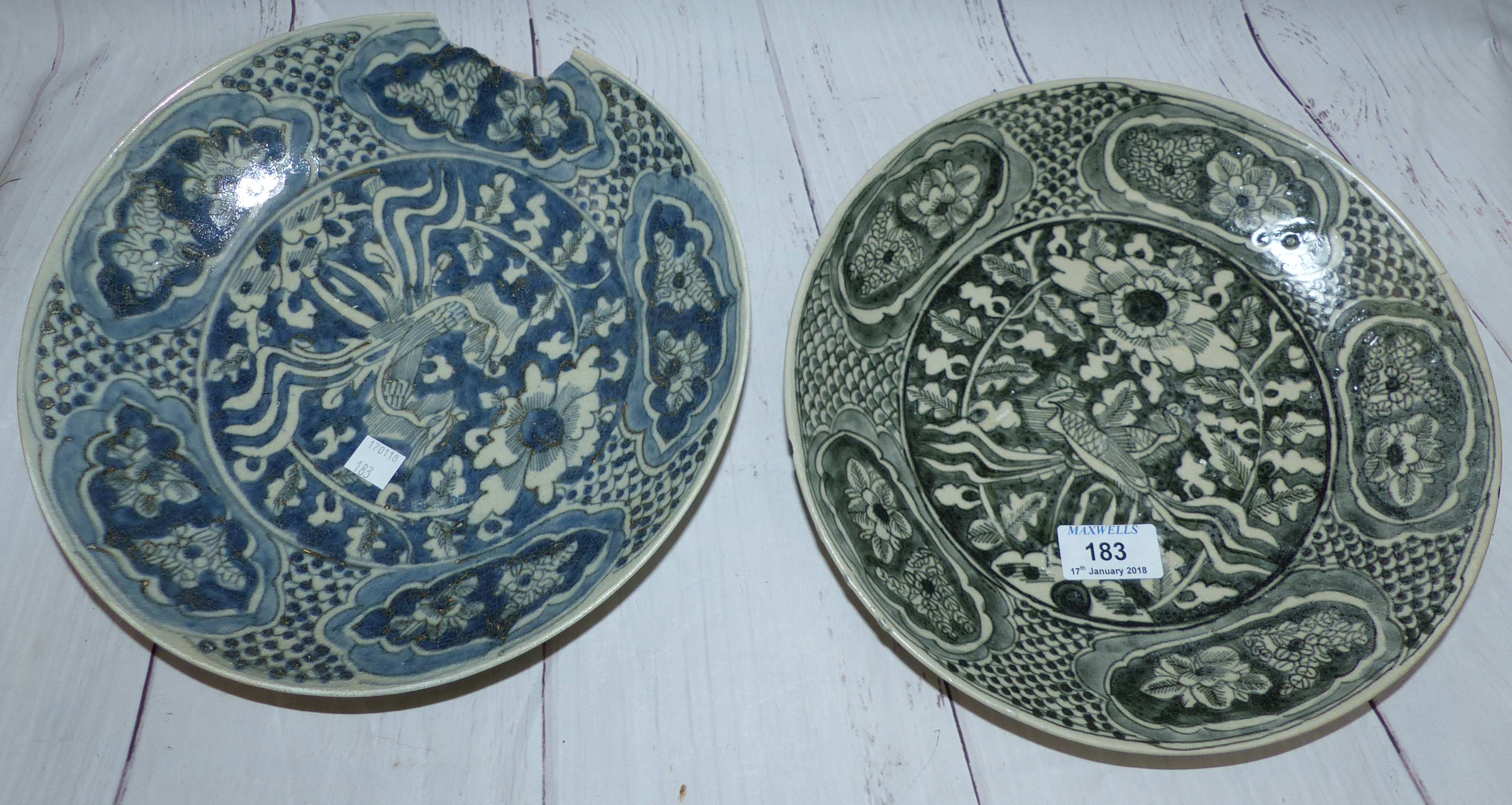 A pair of early 17th century Chinese blue and white circular dishes from the Binn Thun shipwreck,