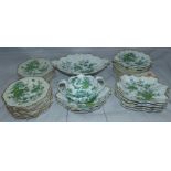 An early 19th century Ridgway dessert service, hand painted in green with flowers in the Chinese