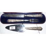 A pair of Victorian cake servers with silver cased handles, boxed; another similar cake slice