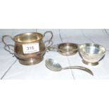 A silver tea strainer with stand, Birmingham 1940, 2½ oz.; a silver sugar bowl with matched sifter